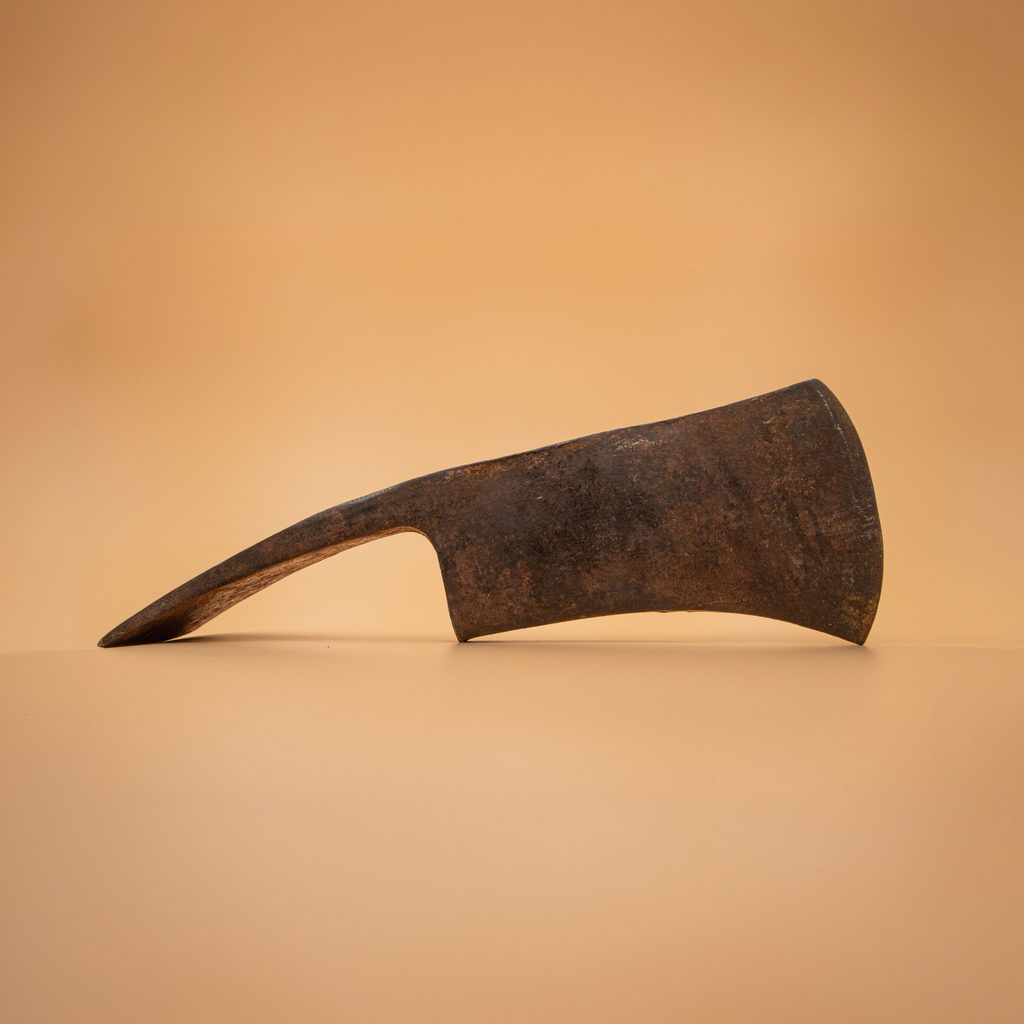Reverse side of a vintage True Temper Pulaski head awaiting restoration before handle installation.