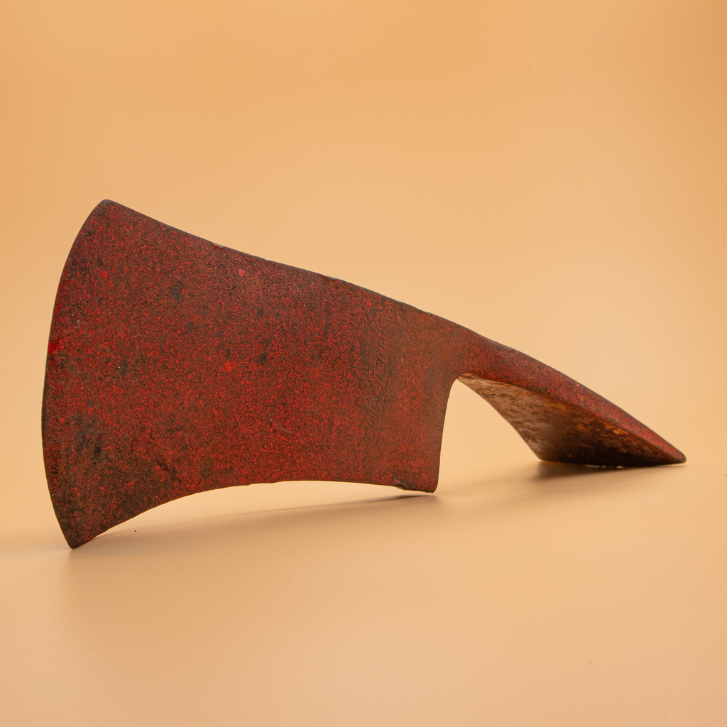 Close-up of the True Temper maker's stamp on a vintage Pulaski head awaiting restoration.