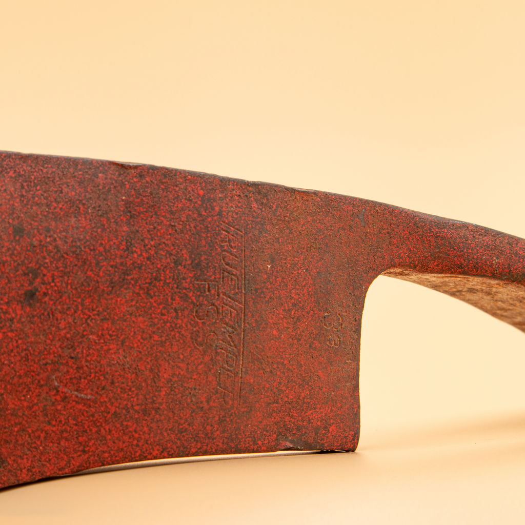 Side profile of the Pulaski grub hoe blade showing its forged shape before restoration.